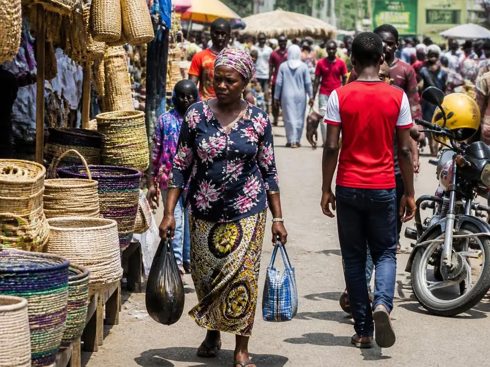 A busy Nairobi market street with woven baskets and vendors
